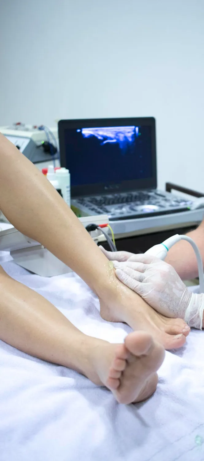 Podiatrist performing a musculoskeletal foot and gait assessment at Flawless Feet