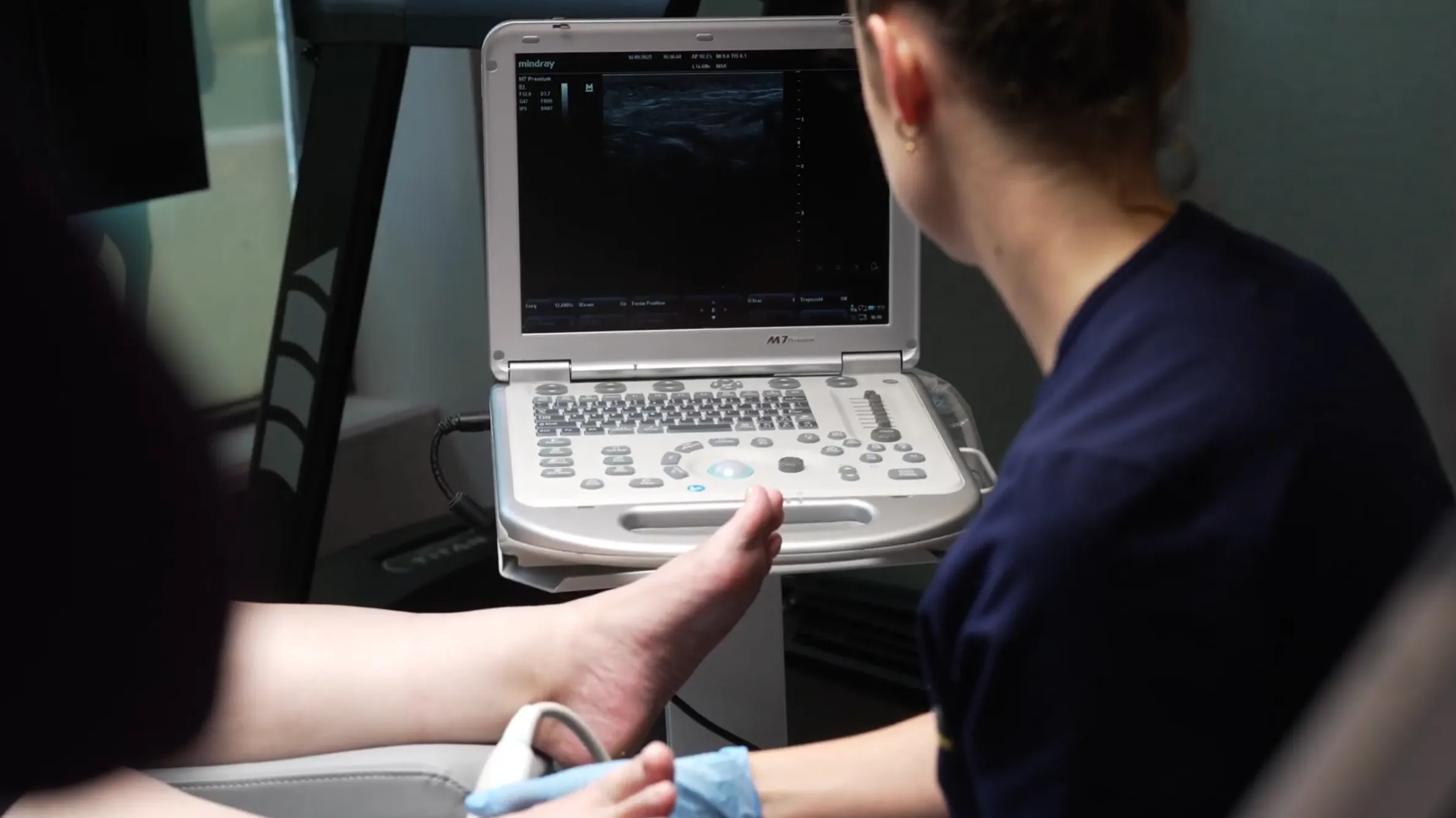 Clinical foot assessment at Flawless Feet, checking arch posture and tendon function